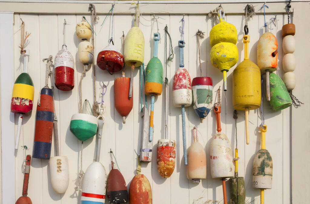 lobster buoys on the wall of the barn